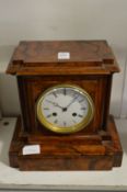 A walnut cased mantle clock.
