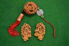 A Chinese carved wood puzzle ball and two other items.