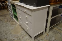 A painted chest of drawers.