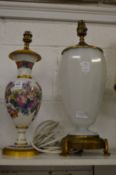 A floral decorated opaque glass table lamp and a large opaque glass table lamp.