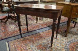 A George III mahogany D shaped fold-over tea table.