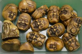 A quantity of miniature Japanese Noh masks.