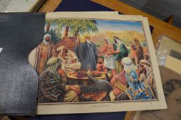 Enid Blyton bible pictures, a folder containing a quantity of unframed prints together with a map of