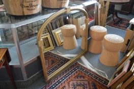 A gilt framed overmantle mirror.