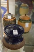 Three Doulton tobacco jars.