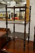 A Victorian rosewood small three tier whatnot.