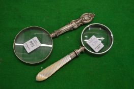 Two magnifying glasses.
