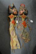 A pair of Balinese carved wood folk art theatre puppets.