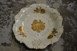 A Dresden porcelain dish with gilded decoration.
