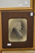 A bust length profile portrait of a gentleman, charcoal, heightened with white, labelled to the