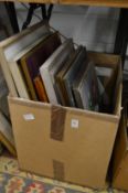 A box of paintings etc.