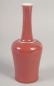A CHINESE REPUBLIC COPPER RED GLAZE BOTTLE VASE, the base with character mark, 23cm high.