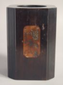A CHINESE WOOD BRUSHPOT, of chamfered square-section with fluted corners, the sides with panels of