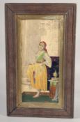 A FRAMED GLAZED POTTERY TILE with Ottoman subject of a lady, 49.5cm x 23.5cm overall.