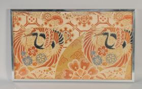 AN EARLY 20TH CENTURY JAPANESE TEXTILE OF CRANES, 32.5cm x 56cm.