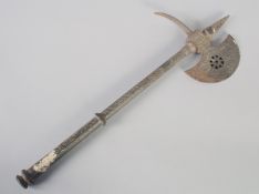 A MIDDLE EASTERN STEEL AXE, with engraved decoration, 54cm long.