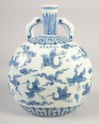 A CHINESE BLUE AND WHITE PORCELAIN TWIN HANDLE MOON FLASK, painted with cranes and clouds, bearing