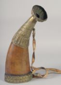 A LARGE 19TH CENTURY BOVINE HORN BRASS MOUNTED POWDER FLASK, 41.5cm long.