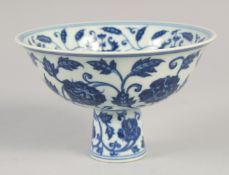 A CHINESE BLUE AND WHITE PORCELAIN STEM BOWL, with foliate decoration all over, six-character mark