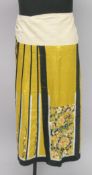 A 19TH CENTURY CHINESE SILK SKIRT, decorated with bats and flowers.