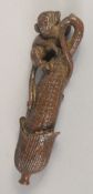 A BRONZE OKIMONO OF A MONKEY AND CORN, 9cm long.