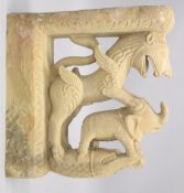 A LARGE 19TH CENTURY INDIAN CARVED ZOOMORPHIC YELLOW STONE ARCHITECTURAL ELEMENT, carved with