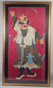 A LARGE EARLY 20TH CENTURY SILK PANEL OF A CHINESE WARRIOR, framed and glazed, textile 156cm x