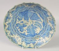 A FINE 17TH CENTURY PERSIAN SAFAVID BLUE AND WHITE DISH, with floral decoration, 28.5cm diameter.