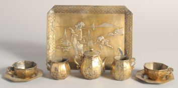 AN EARLY 20TH CENTURY JAPANESE GILDED & SILVERED SOFT METAL MINIATURE PART TEA SERVICE, comprising a