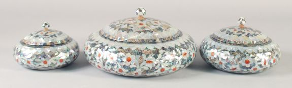 THREE MOTHER OF PEARL AND ABALONE OVERLAID WOODEN LIDDED CIRCULAR BOXES, graduating sizes, largest