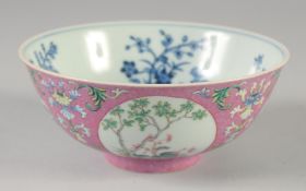 A CHINESE FAMILLE ROSE MEDALLION BOWL, with blue and white interior, bearing Daoguang mark but