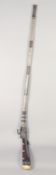 AN EARLY 19TH CENTURY AFGHAN MATCHLOCK RIFLE, with bone stock and metal mounts, 153.5cm long.