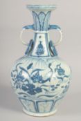 A CHINESE BLUE AND WHITE PORCELAIN TWIN HANDLE VASE, the handles formed as elephants, 35.5cm high.