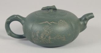 A CHINESE GREEN YIXING TEAPOT, impressed trade mark to base, 19cm spout to handle.