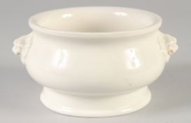 A BLANC DE CHINE TWIN HANDLE CENSER, with molded lion dog handles, bearing character mark to base,