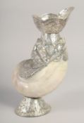 A BURMESE SILVER AND MOTHER OF PEARL CONCH SHELL VASE, 25.5cm high.
