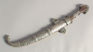 A 19TH CENTURY MOROCCAN KAMAYA SILVER MOUNTED DAGGER, and scabbard, 41cm long.