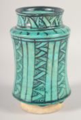 A MAMLUK GLAZED POTTERY ALBERELLO MEDICINE JAR, 17cm high