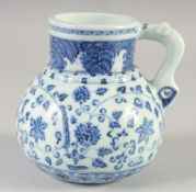 A CHINESE BLUE AND WHITE PORCELAIN JUG, with floral decoration, bearing six-character mark, 14cm