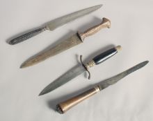 A 19TH CENTURY INDIAN DAGGER, together with two European daggers, one with rhino horn handle, and an