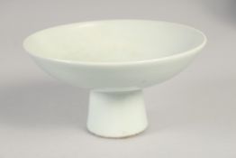 A WHITE GLAZE CARVED DRAGON STEM CUP, 15cm diameter.