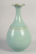 A CHINESE CELADON GLAZE VASE, with petal-form rim, 27cm high.
