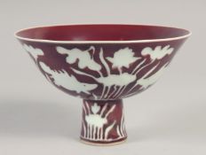 A CHINESE IRON RED PORCELAIN STEM BOWL, with fish and algae, six-character mark to inner foot rim,