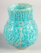A FINE 12TH-13TH CENTURY PERSIAN KASHAN TURQUOISE GLAZED POTTERY VASE, 14.5cm high.