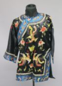 AN EARLY 20TH CHINESE WOMAN'S ROBE, decorated with phoenix and flora and butterflies.