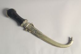 AN EARLY 20TH CENTURY MOROCCAN KAMBAYA DAGGER, and scabbard, 42cm long.