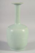 A CHINESE CELADON VASE, 26.5cm high.