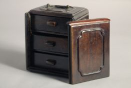 A 20TH CENTURY CHINESE HARDWOOD BOX, with sliding front panel and three interior drawers, 5.1in