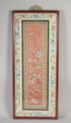 A 19TH CENTURY CHINESE SILK PANEL, of female figures, framed and glazed, textile 66cm x 26cm.
