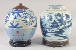 TWO CHINESE BLUE AND WHITE PORCELAIN JARS AND COVERS, each on fitted hardwood stands, 26cm and
